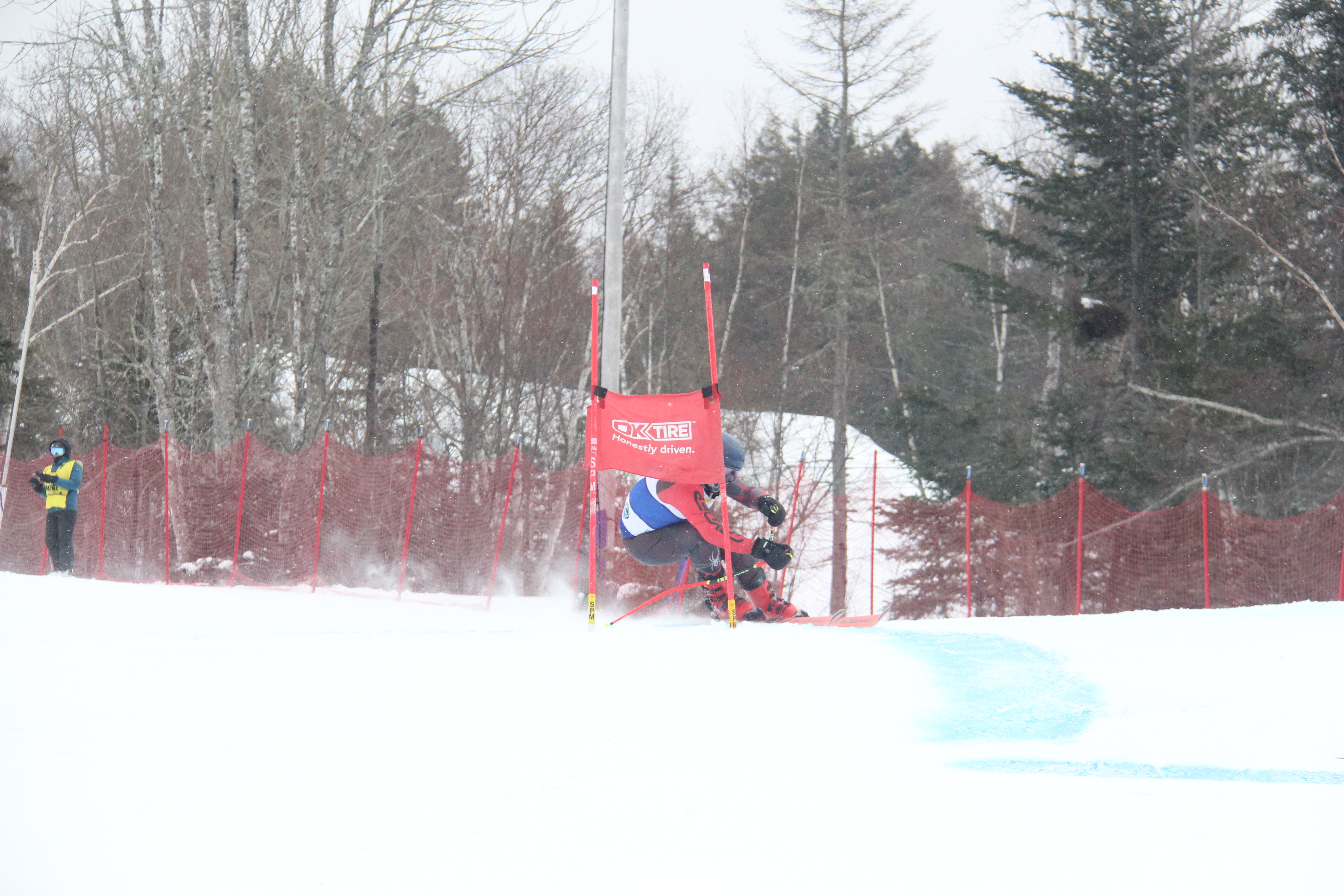 Ski NB athlete skiing through gates