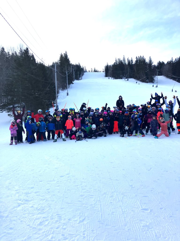Young Ski NB athletes gathered on snow