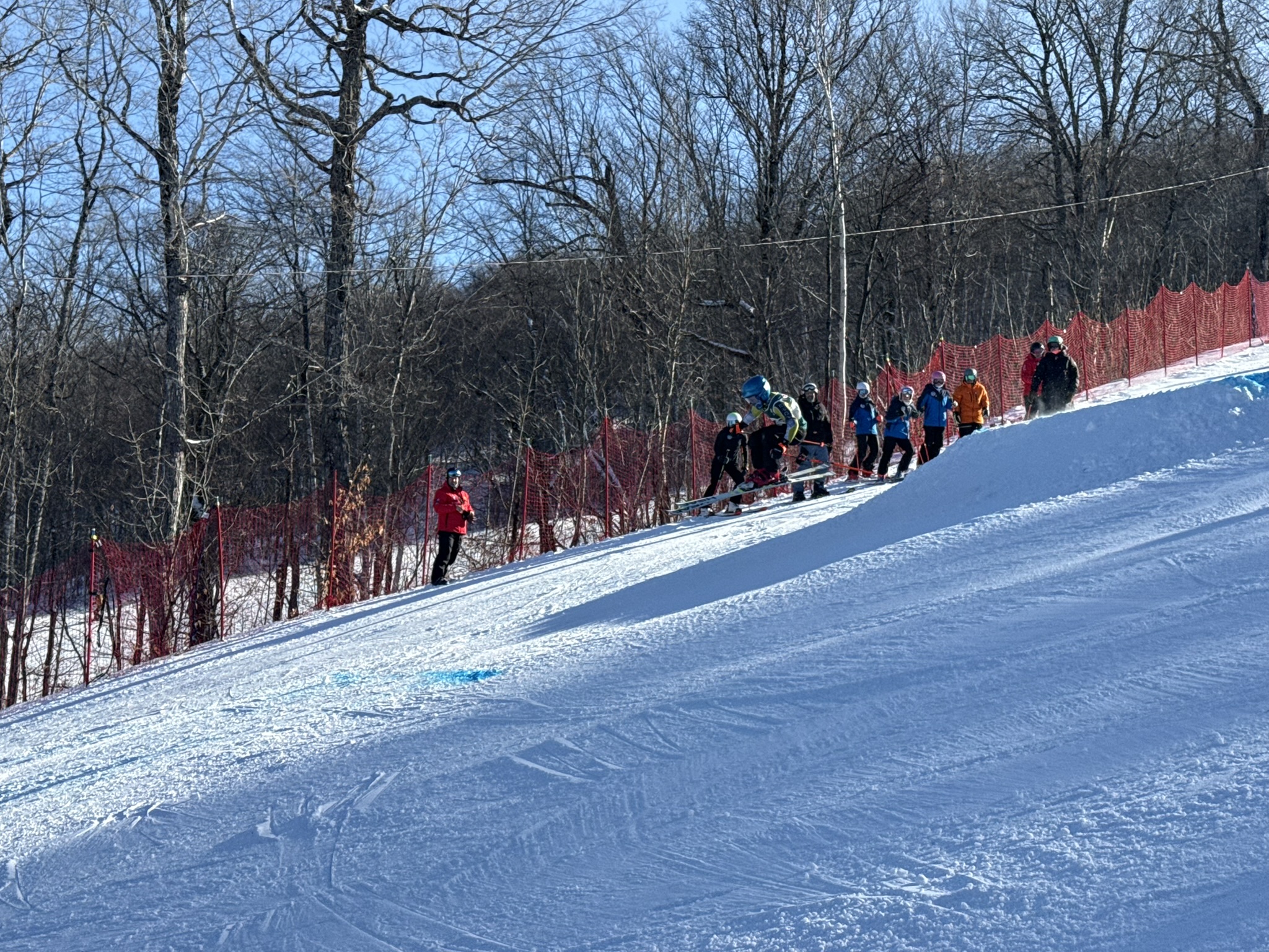 Athlete going over a jump during Ski NB skills day