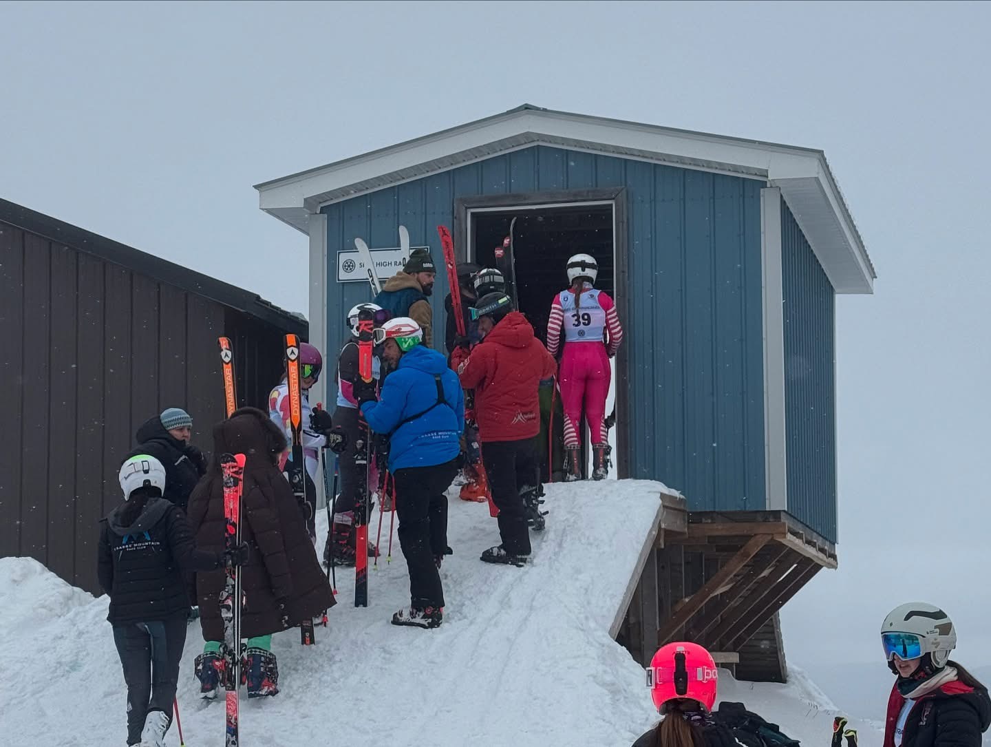 Athletes and volunteers at a race day start area